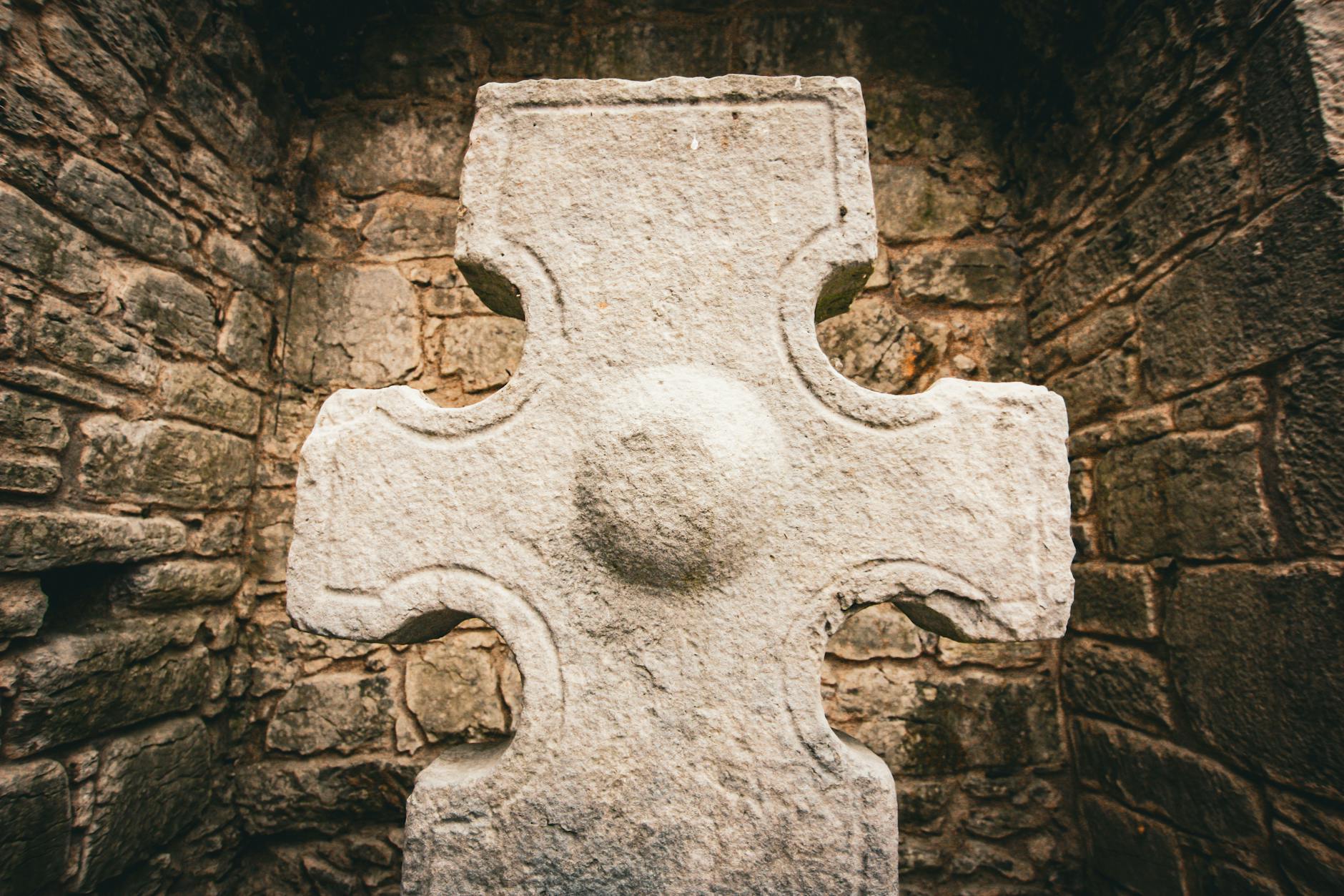 Ancient Celtic stone carving depicting interconnected family symbols